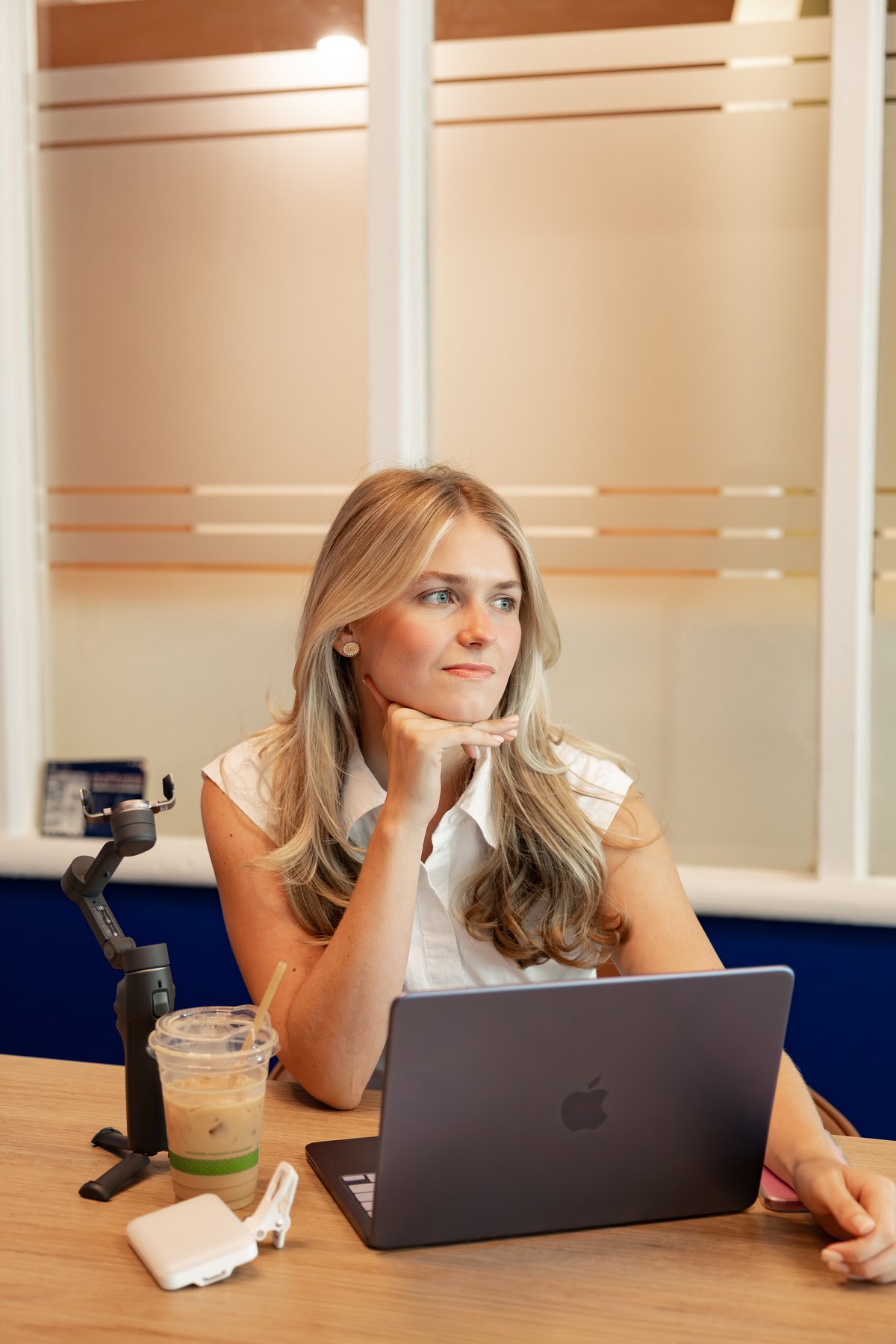 Liv thinking at her desk